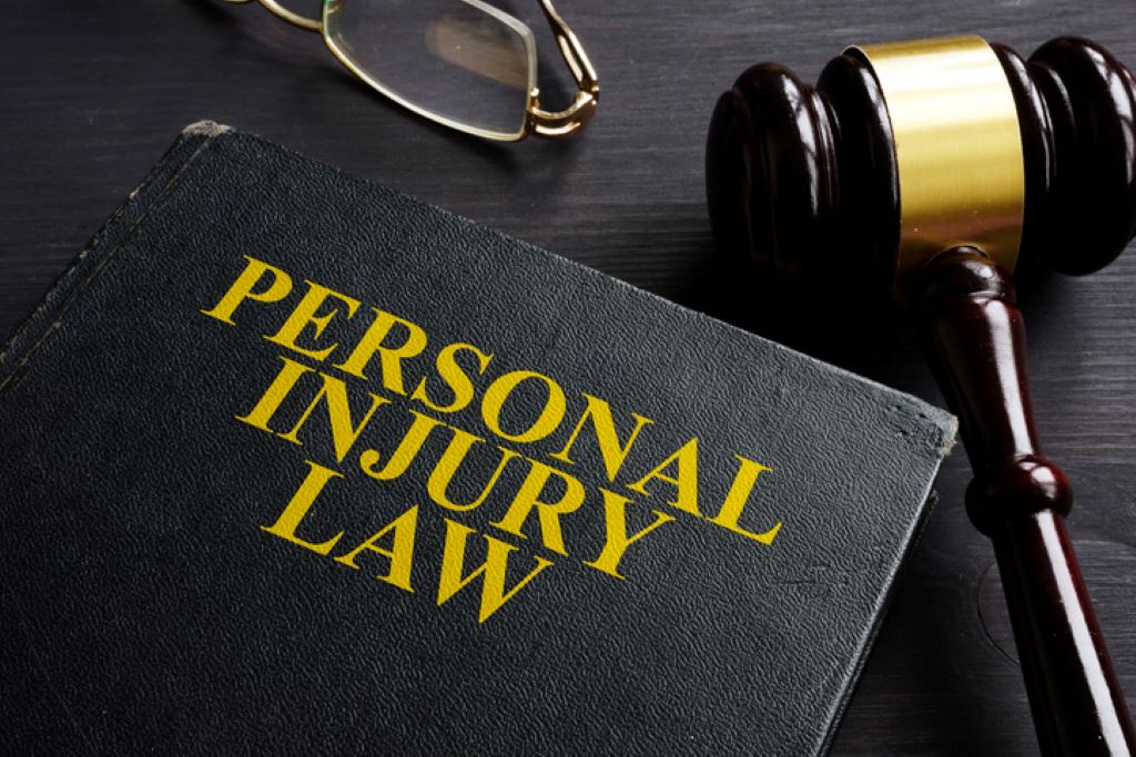 Personal Injury Law book and a black desk