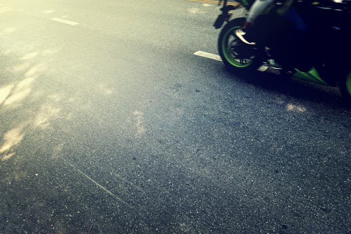 Motorcycle on road lane splitting
