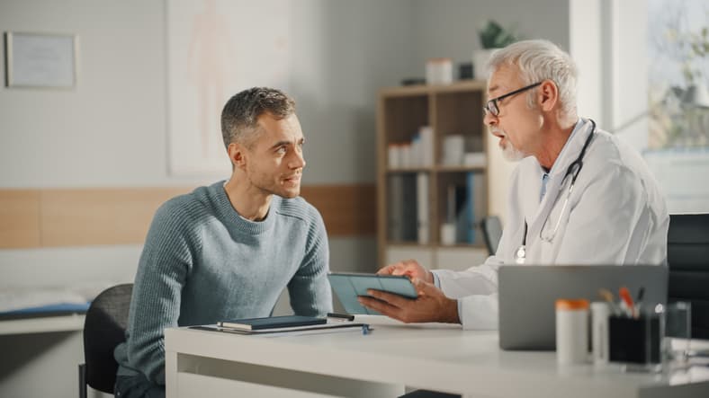 Man visiting with doctor in office