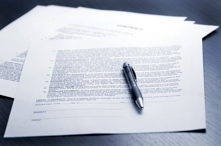 legal settlement paperwork with pen