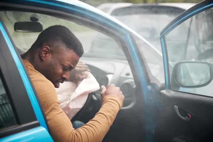 Man In Car After Car Accident With Air Bag Deployed