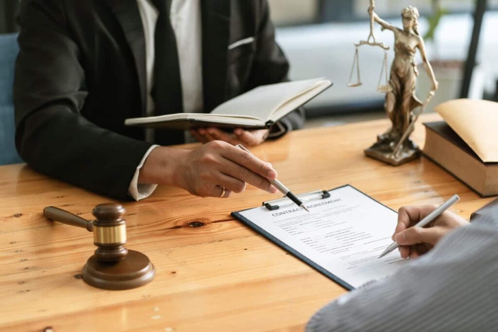 A car accident attorney meeting with a client