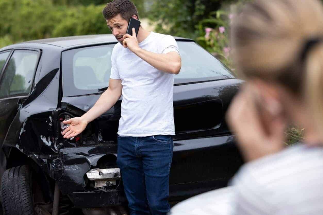 Uber Accident Lawyer In Tampa 2 Man On Phone After An Uber Car Accident
