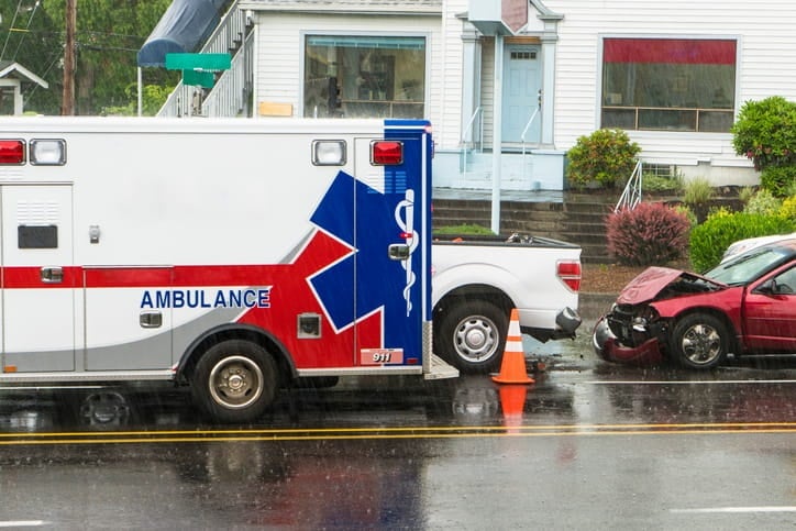 A personal injury car accident scene with an ambulance.