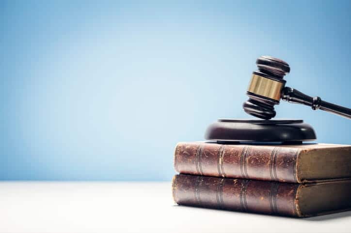 a gavel sitting on top of two personal injury law books
