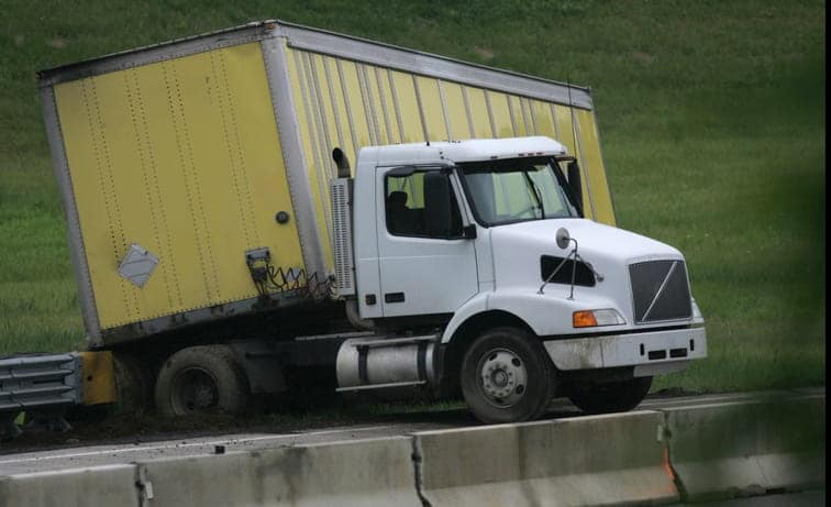 A Jack-Knifed Semi-Truck On The Highway.