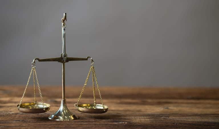 The scales of justice on a car accident lawyer's desk. 