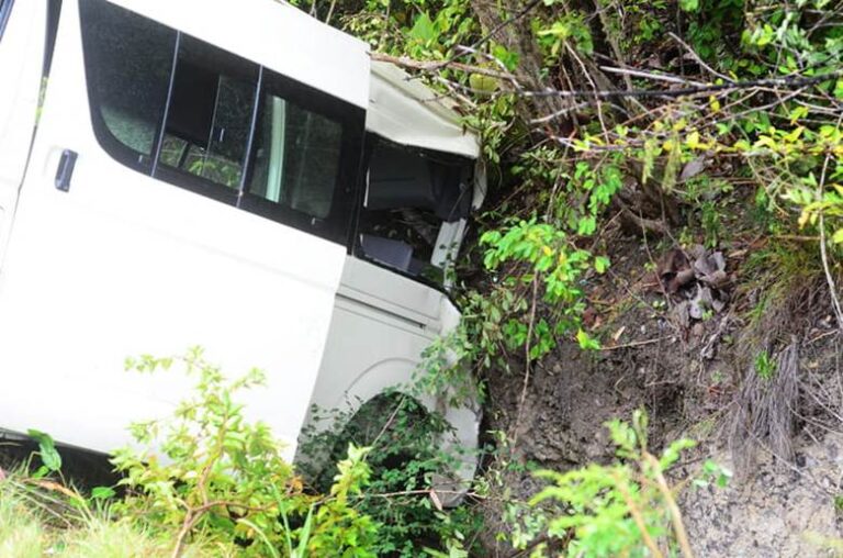 A Bus Crashed On The Side Of The Road.