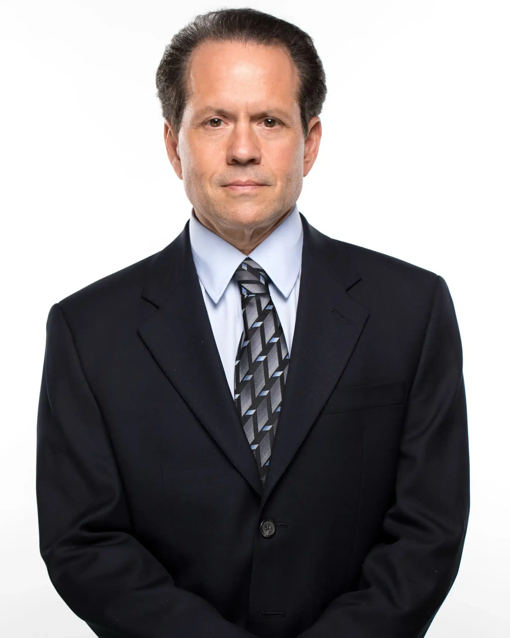 Tampa Truck Accident Lawyer 1 Formal Headshot Of Jack Bernstein, Tampa Injury Attorney, Wearing A Dark Suit And Patterned Tie Against A White Background.