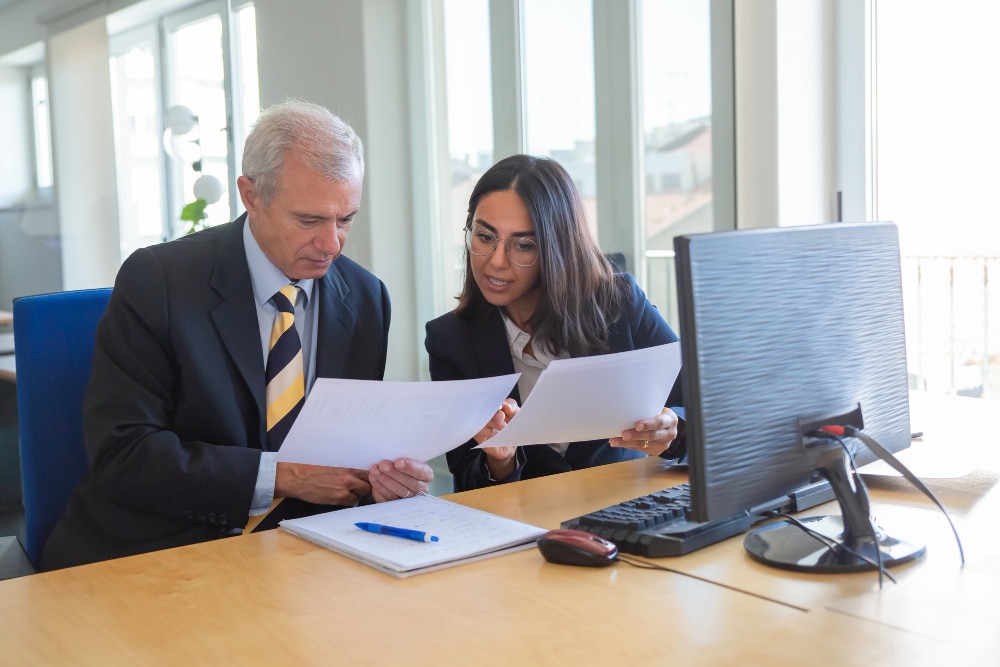 Seminole Heights (33604) Personal Injury Lawyer Tampa 1 Personal Injury Attorney Reviewing Accident Claim Documents With An Injury Victim During A Free Legal Consultation At A Tampa Law Office.