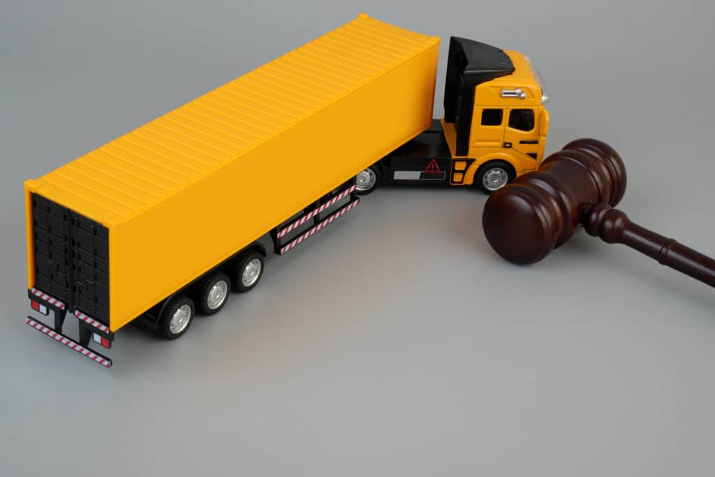 Semi Truck Model And Judge Gavel Symbolizing Commercial Trucking Law And Liability